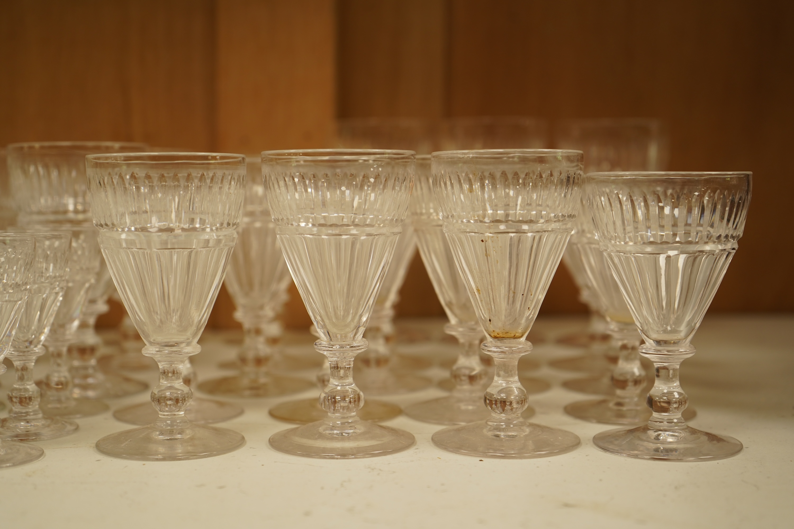 A part suite of 19th century cut glass drinking glasses, largest 13cm high